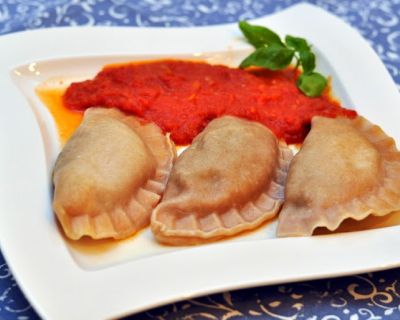 Spinatravioli in feiner Tomatensauce